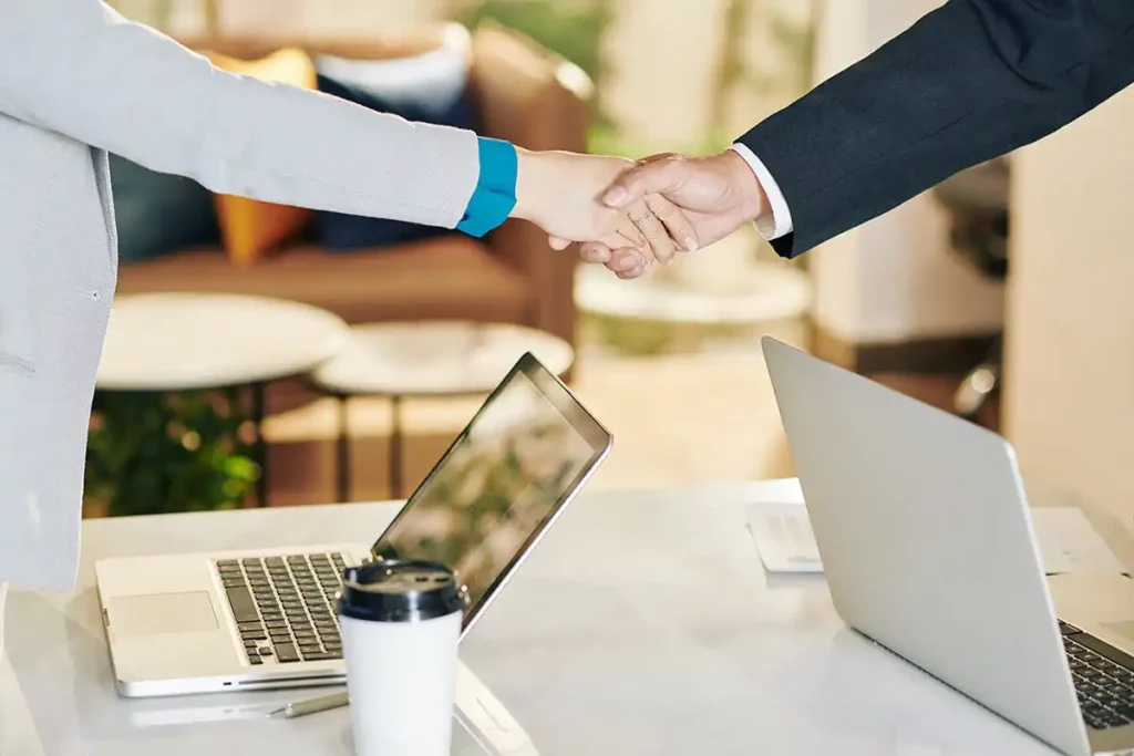 Hand Shakes at a computer